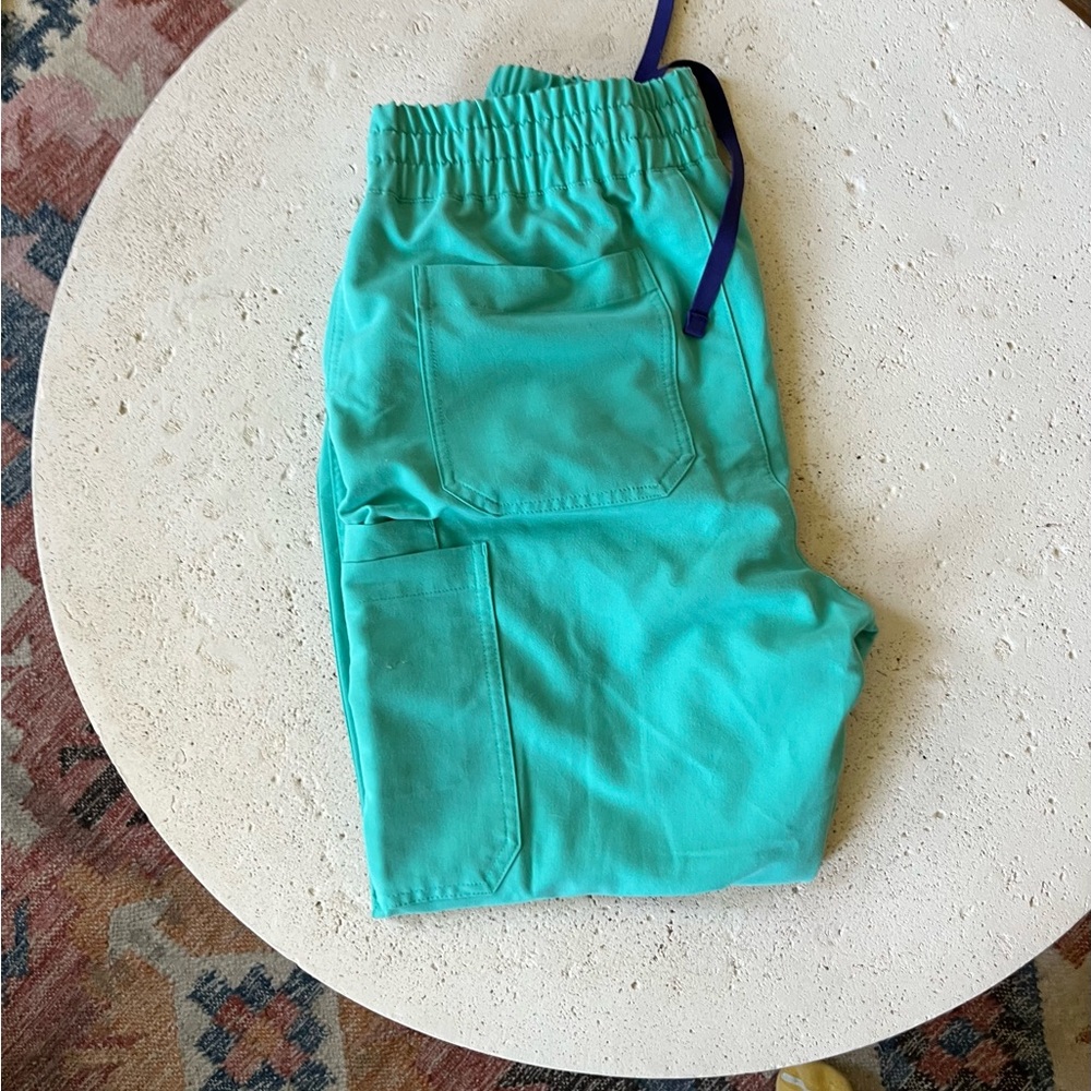 Figs Cade scrub pants in bright aqua color medium petite